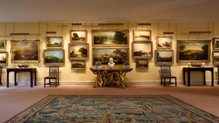 Paintings on display in the Upper Gallery at Anglesey Abbey, Cambridgeshire